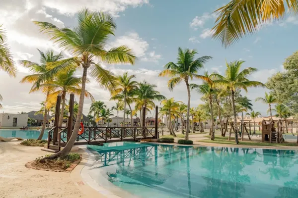 Palm-lined pool and footbridge