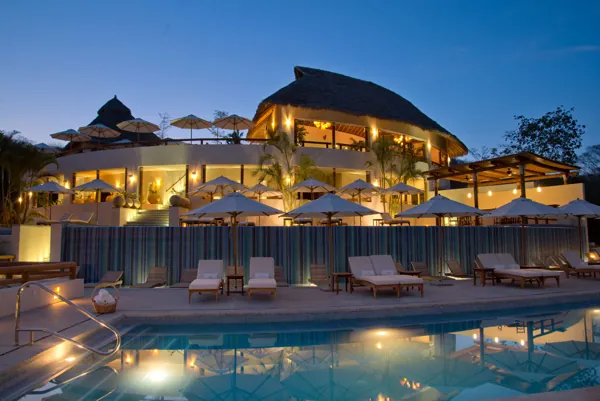 Grand Matlali · pool and clubhouse at dusk