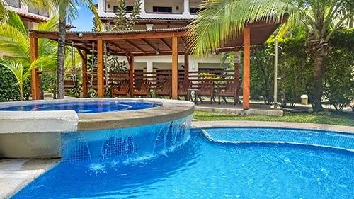 Poolside relaxation beneath the palms