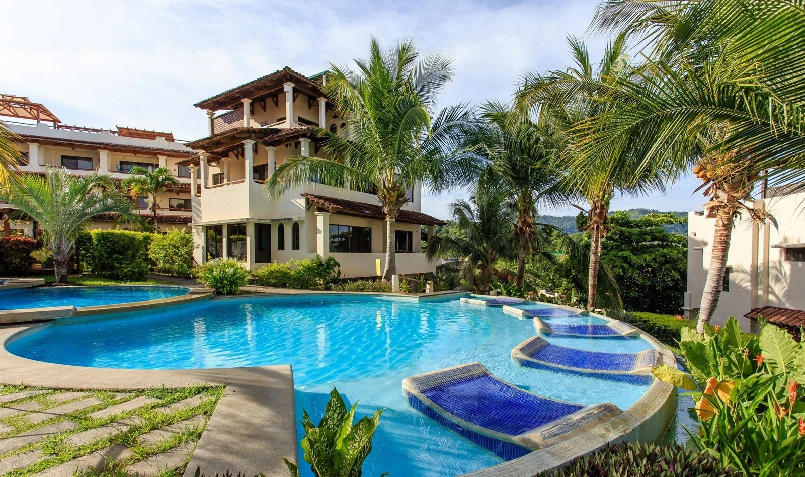 Sapphire Residences tropical pool courtyard and palms