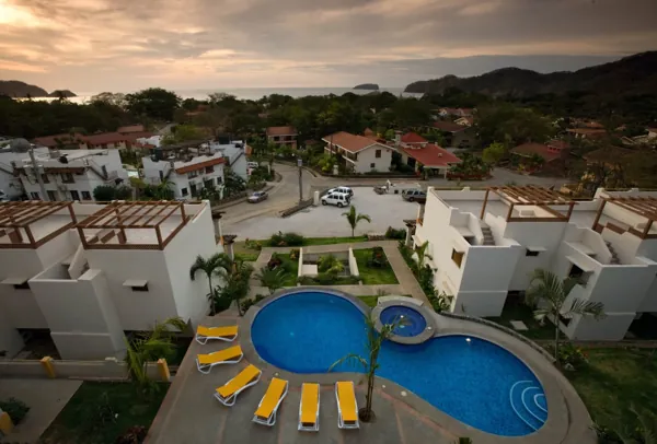 Pool courtyard and surrounding hills at dusk